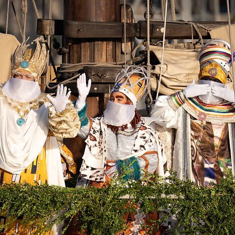 Persons performing as The Three Wise Men arrive at the port of Barcelona, Spain, 05 January 2022