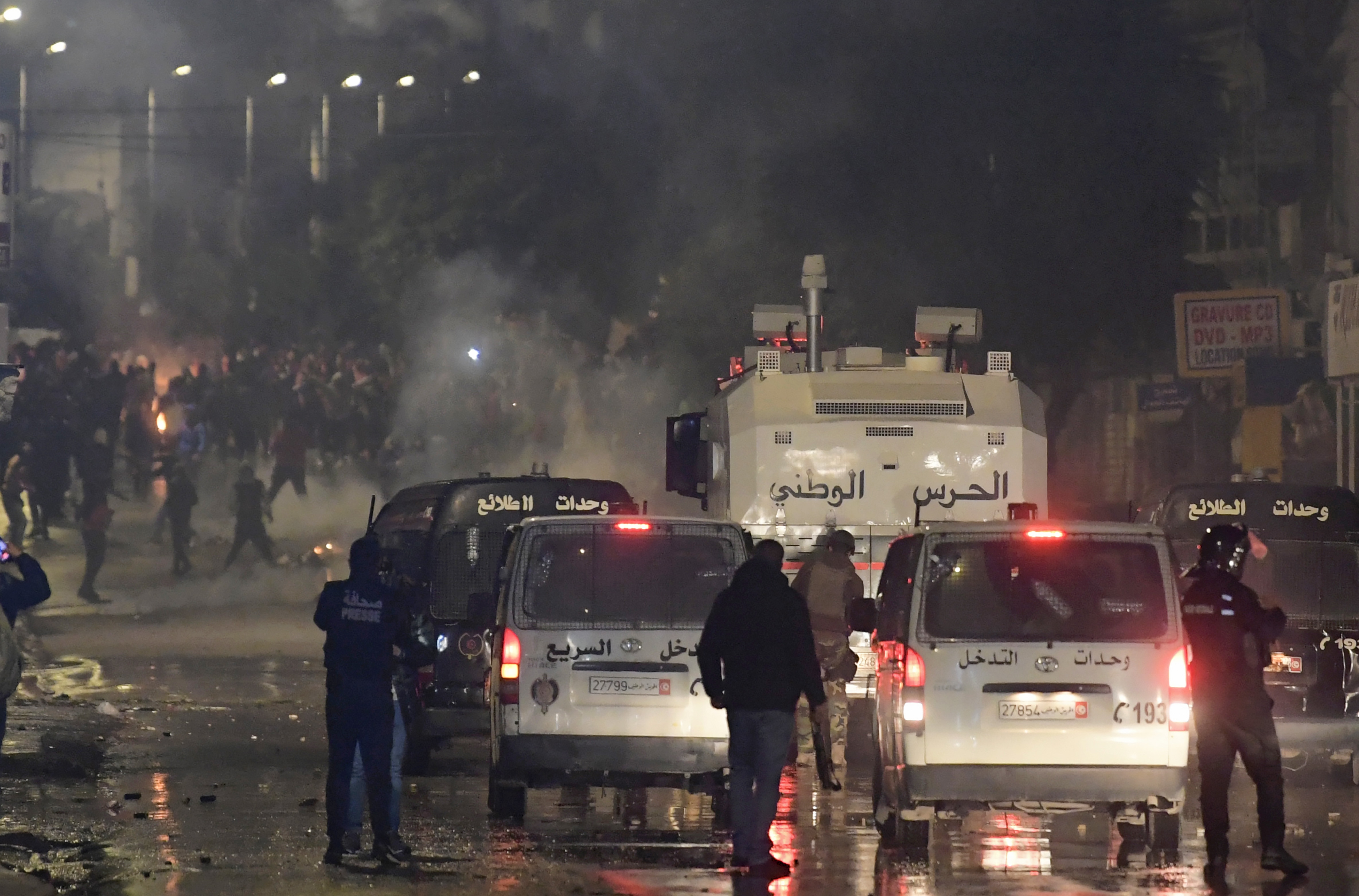 Tunisian protesters confront security forces in Ettadhamen on the northwestern outskirts of Tunis on 18 January.