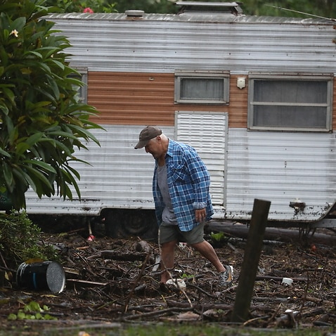 A man surveys damage at his home in Port Macquarie, NSW, Tuesday, March 23, 2021.