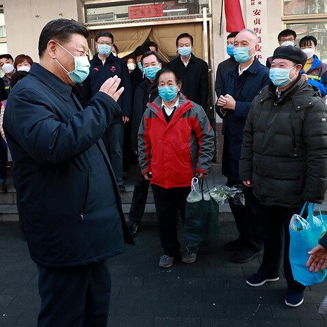 Chinese President Xi Jinpingspeaks to residents as he inspects the coronavirus pneumonia prevention and control work at a neighbourhoods in Beijing.