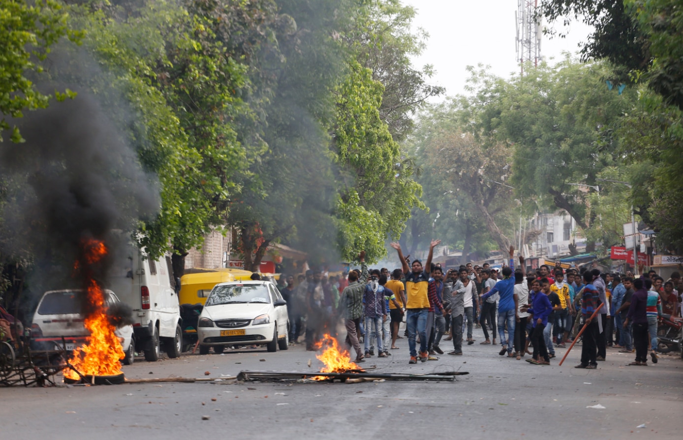 India's lower caste Dalits burn tires to block traffic during a nationwide strike in Ahmadabad.