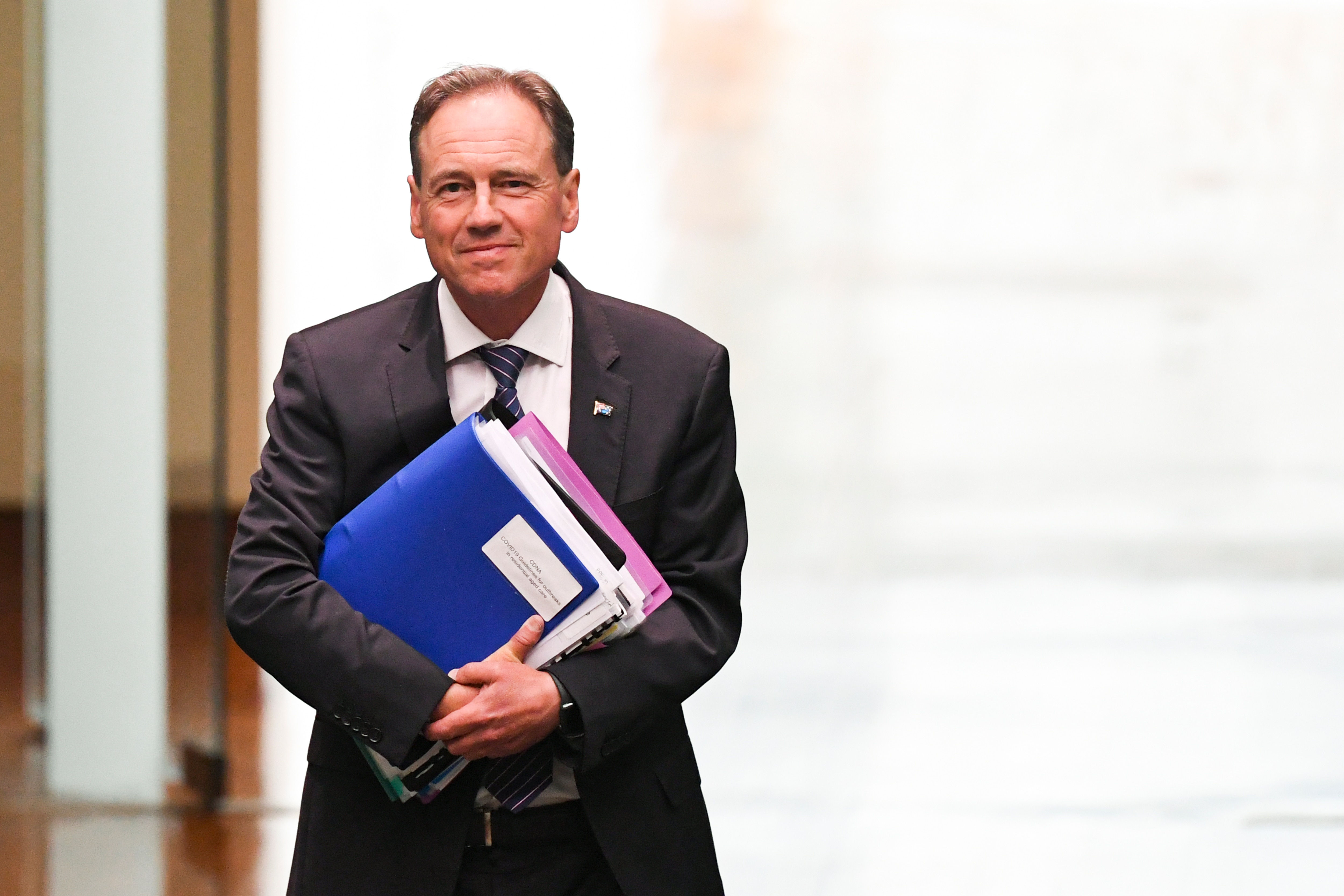 Australian Health Minister Greg Hunt arrives during House of Representatives Question Time at Parliament House in Canberra, Wednesday, February 3, 2021. (AAP Image/Lukas Coch) NO ARCHIVING