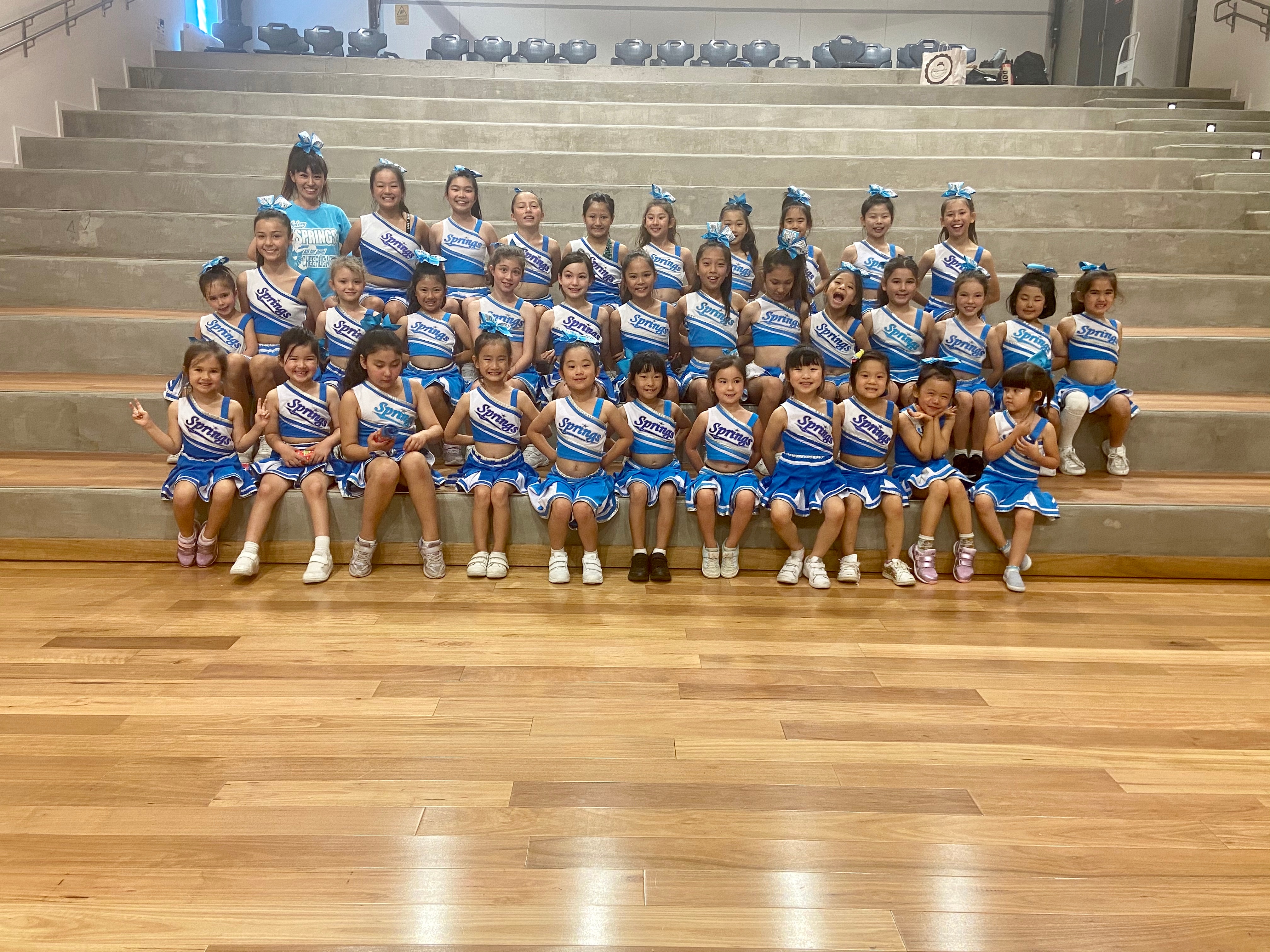 Students of a Sydney-based kids cheerleading team Springs pose for a group photo. They are attending Japanese Saturday schools to learn the language Sydney cheerleading Springs Japanese kids