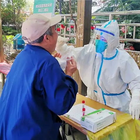 Officials in Shanghai have confirmed the first death in the city's COVID-19 outbreak, which has resulted strict lockdowns, and compulsory testing.