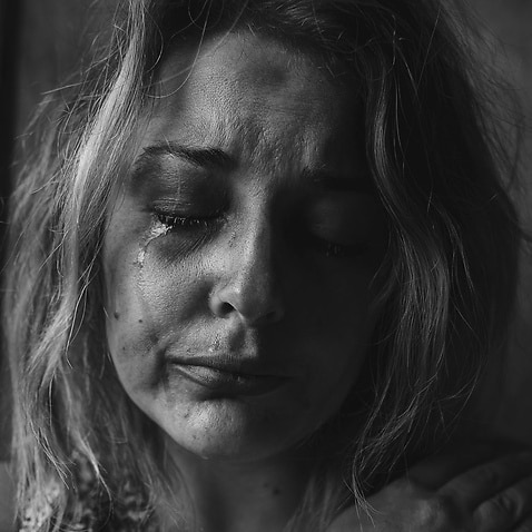 Image of a distressed woman by Unsplash