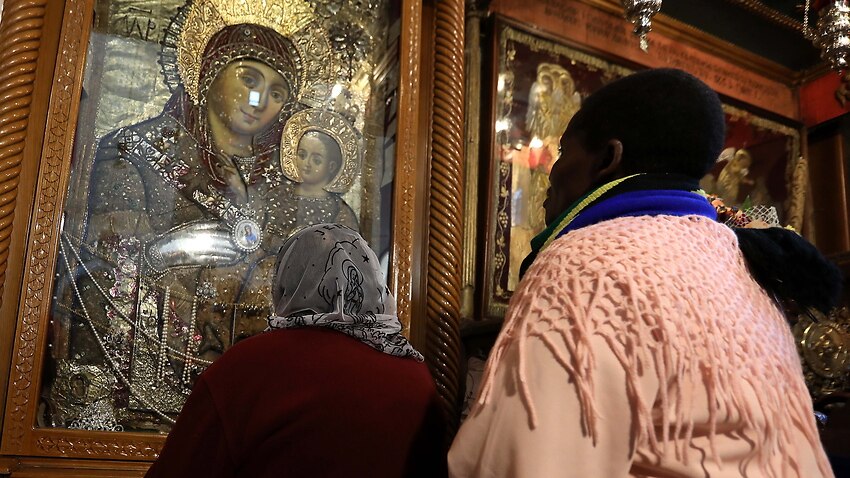 A visitor is seen in prayer at the Church of Nativity in the West Bank town of Bethlehem.