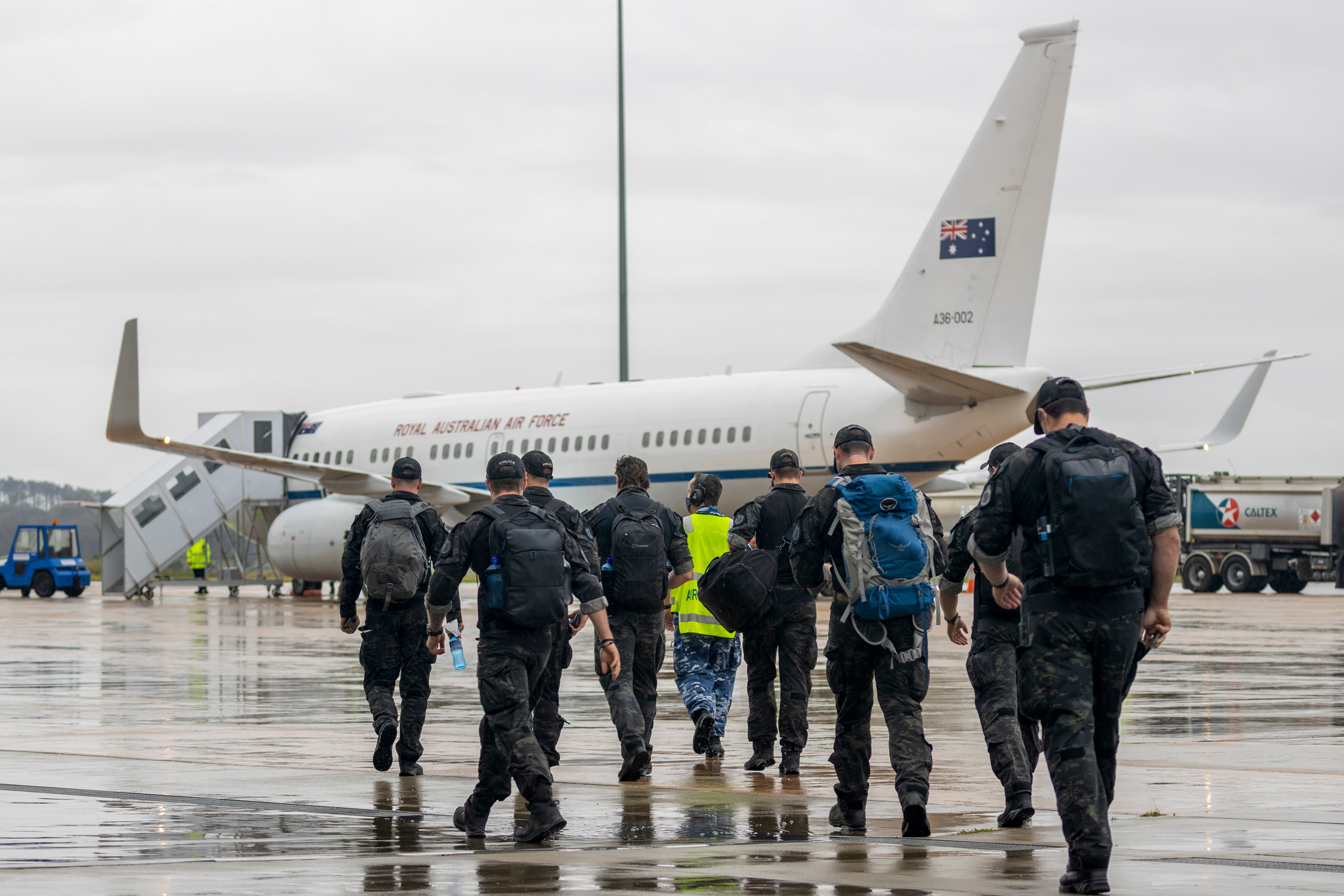 Australian Federal Police Special Operations members prepare to depart Canberra, for the Solomon Islands.
