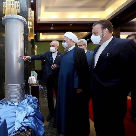 President Hassan Rouhani visiting an exhibition of Iran's nuclear achievements in Tehran, Iran, Saturday, April 10, 2021.agreement. 