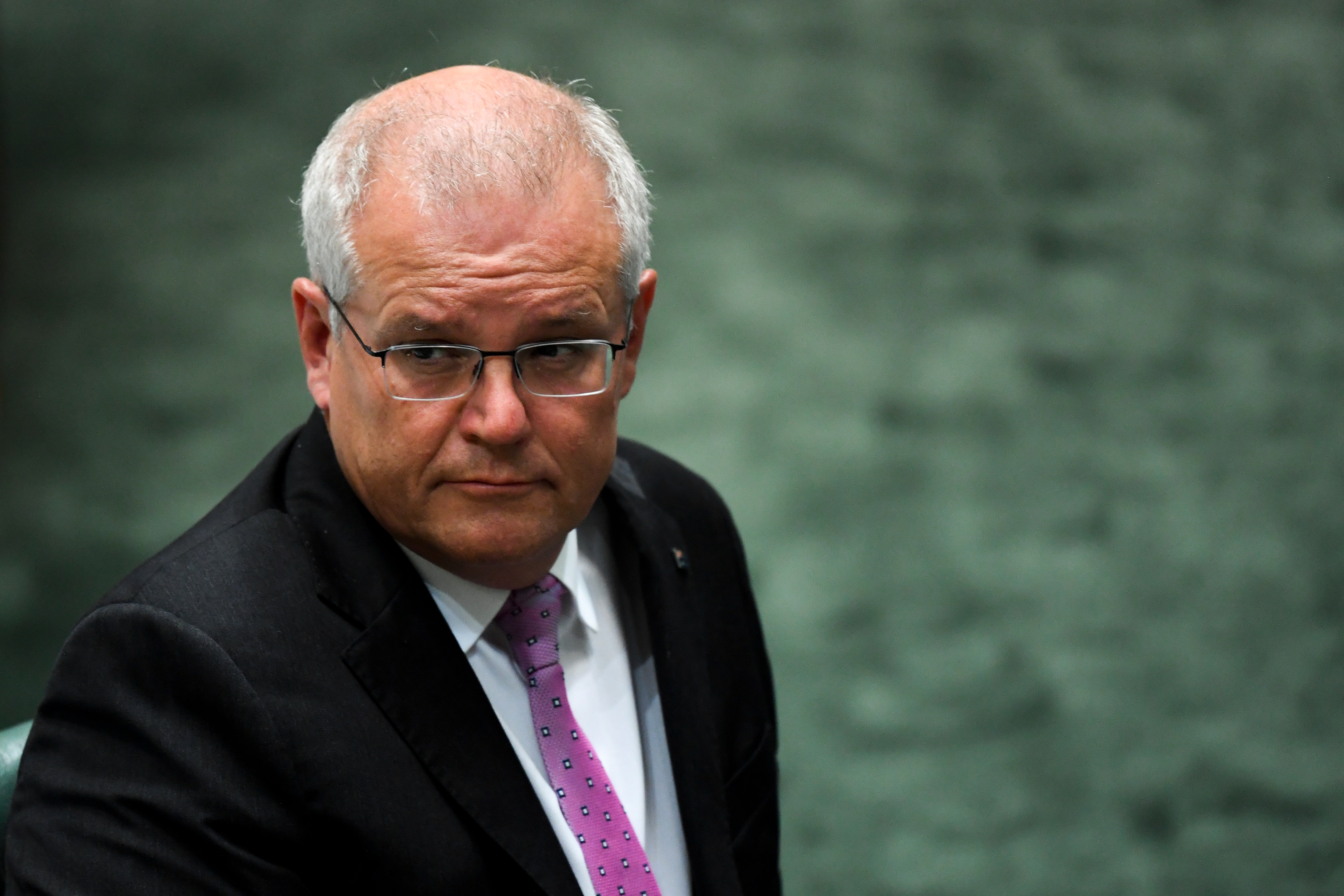 Prime Minister Scott Morrison reacts during Question Time at Parliament House.