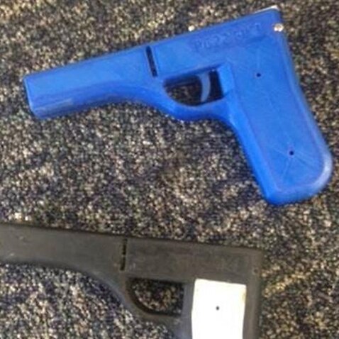 A supplied image of 3D printed guns, that were seized by QLD Police.