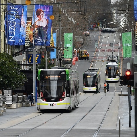 Trams pictured along Bourke Street in Melbourne on 23 July, 2021. 