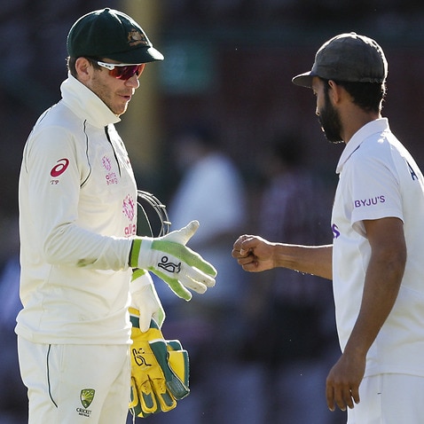 Australia’s Tim Paine and India's Ajinkya Rahane on the final day of cricket 
