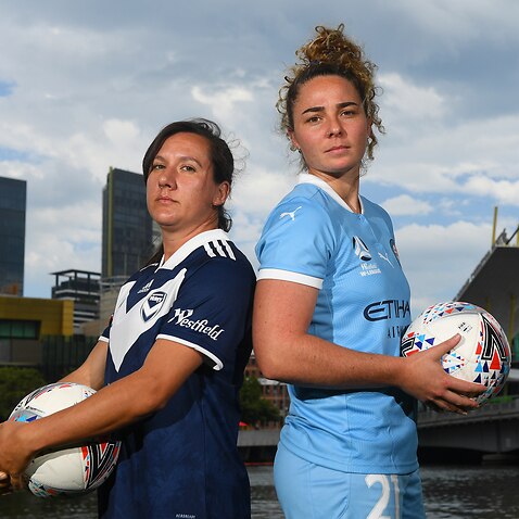 Lisa De Vanna of Melbourne Victory (left) and Jenna McCormick of Melbourne City  pose for a photograph during an A-League and W-League media event at Batman Park, in Melbourne, Thursday, December 17, 2020.  (AAP Image/James Ross) NO ARCHIVING