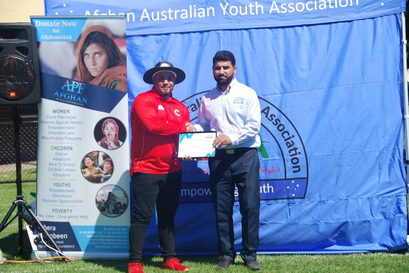 Ziaulaq Abdulrahimzai, a member of Afghan Australian Youth Association (right).