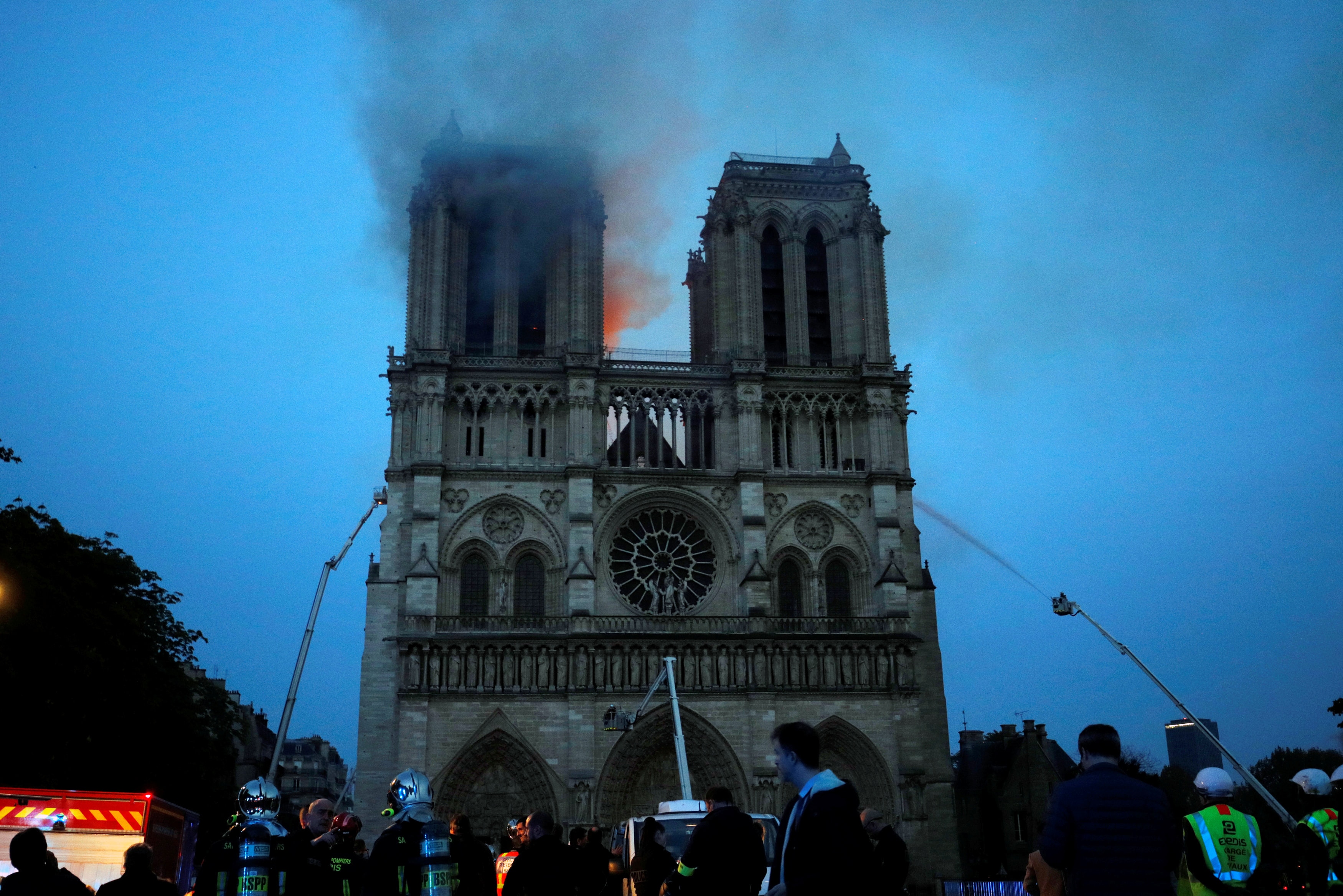 Firefighters train their hoses on Notre Dame Cathedral in Paris. Firefighters train their hoses on Notre Dame Cathedral in Paris on Monday night, April 15, 2019.
