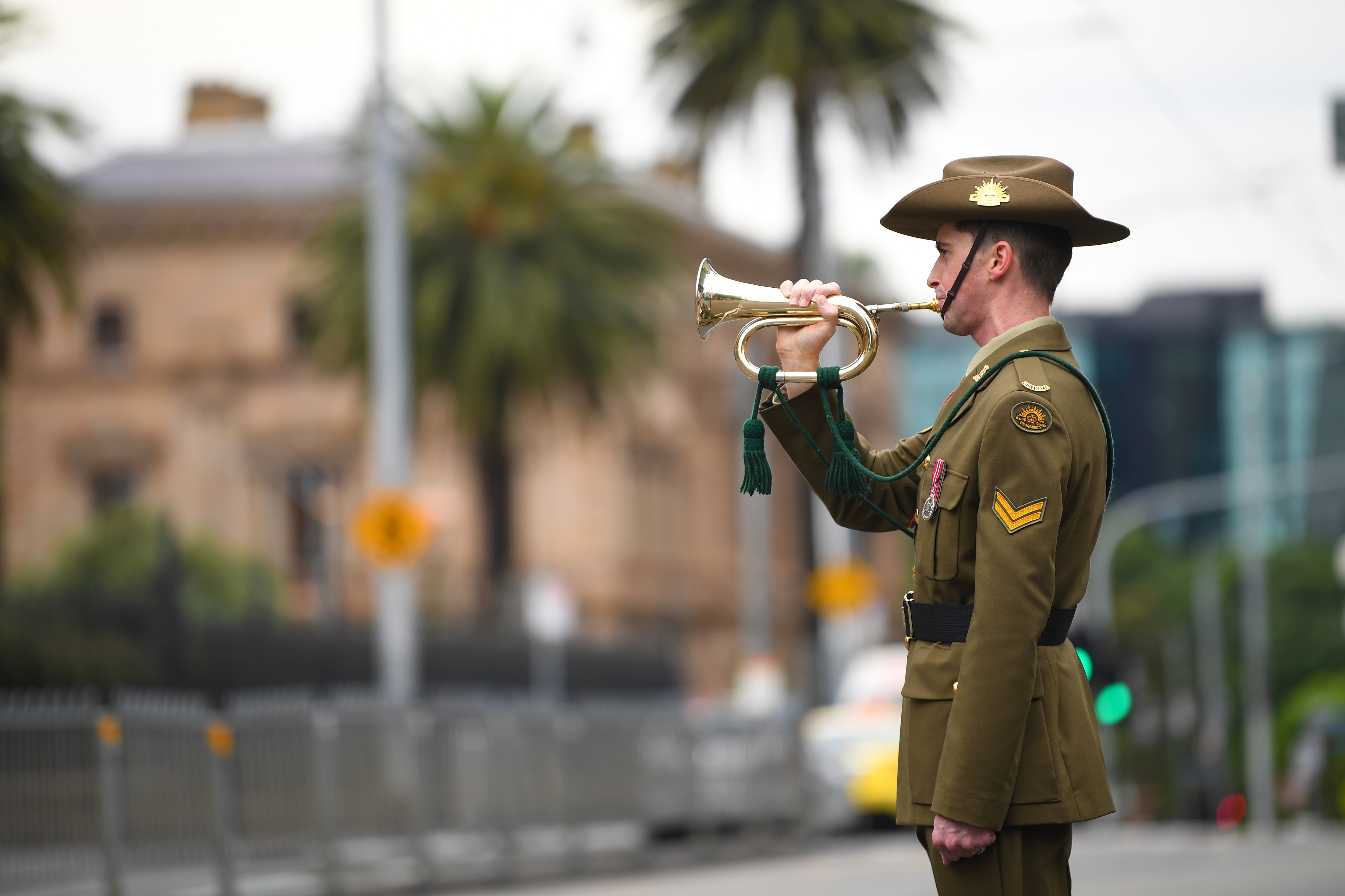 A bugler is seen during a Remembrance Day service outside the Parliament of Victoria in Melbourne on Wednesday.