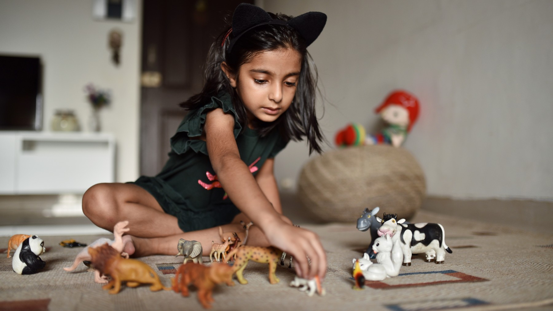 Indian girl playing with toys