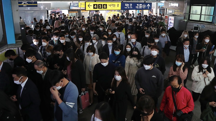 Commuters change trains in the morning rush hour at a subway station in Seoul, South Korea on Monday.
