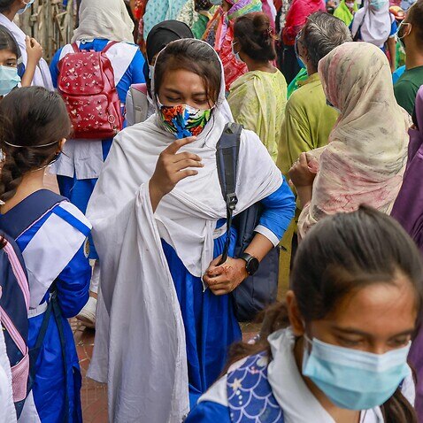 Students crowd outside Motijheel Ideal School and College in Dhaka, Bangladesh, September 13, 2021. 