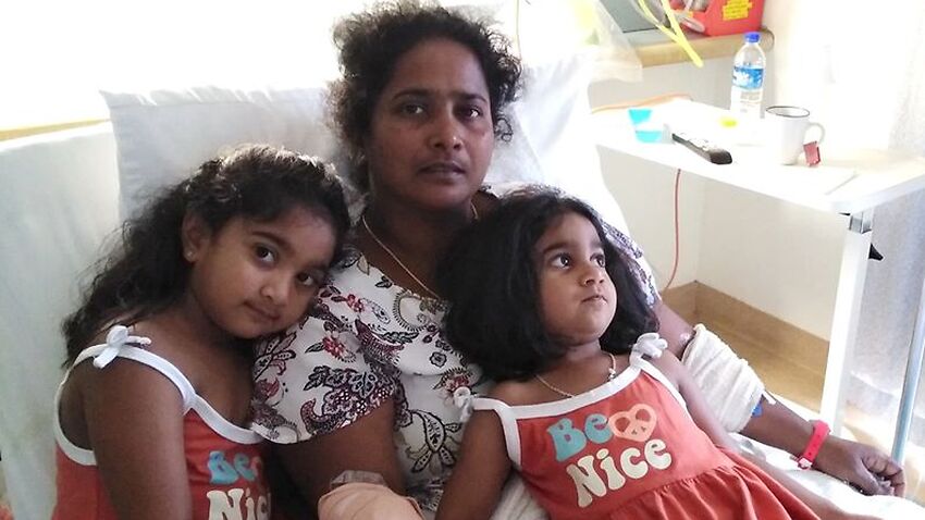 Priya Murugappan and her daughters at the Christmas Island hospital prior to her medical evacuation to Perth.