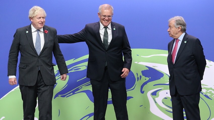 British Prime Minister Boris Johnson (L) and United Nations Secretary General Antonio Guterres (R) greet Scott Morrison at the COP26 Summit in Glasgow.