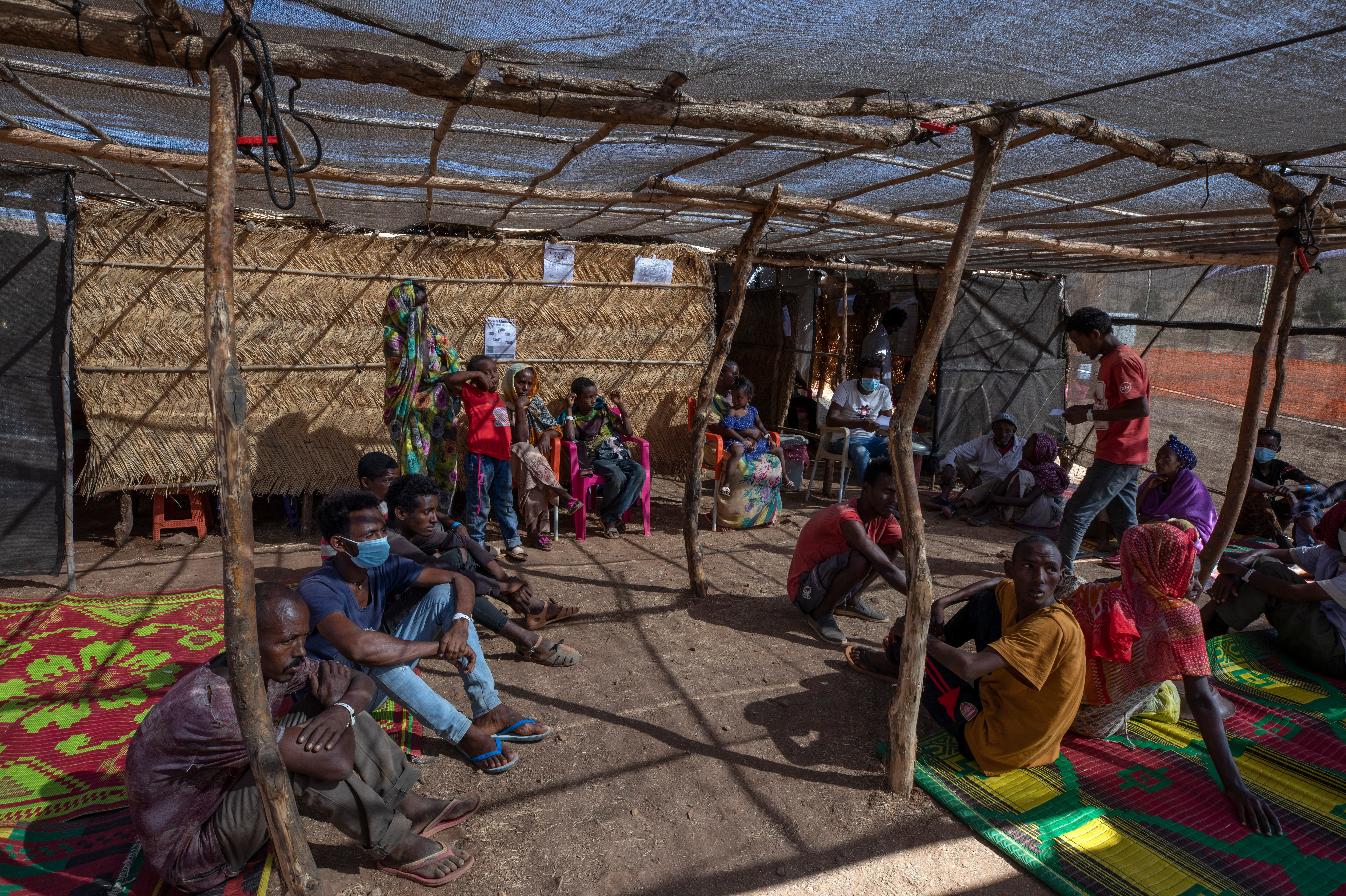 Tigrayans who fled the conflict in Ethiopia's Tigray region wait to receive treatment at a refugee camp in eastern Sudan.