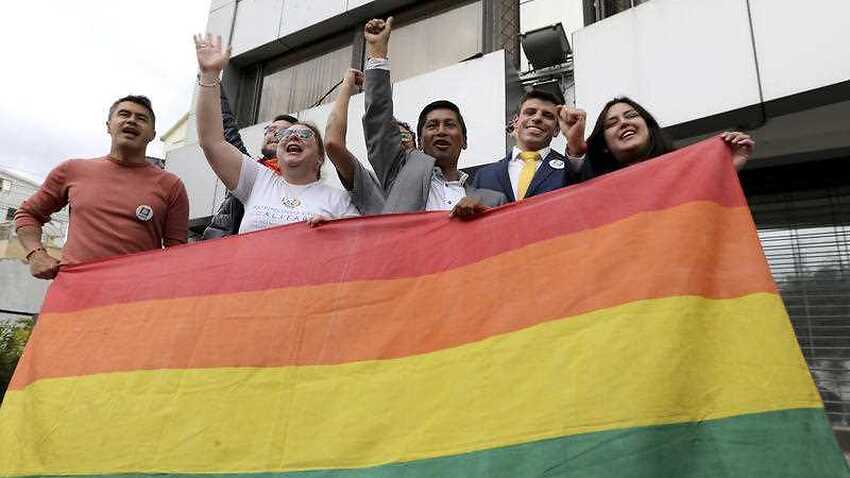 People celebrate outside the court in Quito, Ecuador, after judges ruled in favour of gay marriage.