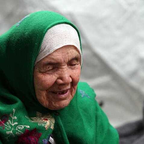 105-year old Afghan regugee Bibihal Uzbeki from Kunduz, Afghanistan, rests in Croatia's main refugee camp at Opatovac, Croatia, near the border with Serbia