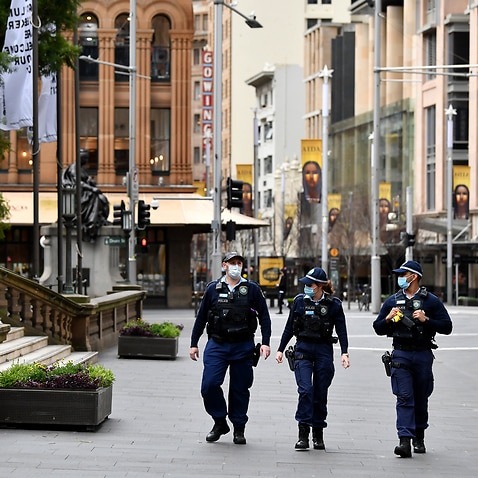 NSW Police patrol George Street in Sydney's CBD on Tuesday, 20 July, 2021. 