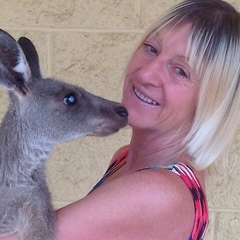Wildlife carer Linda Smith is in hospital after being attacked by a kangaroo. 