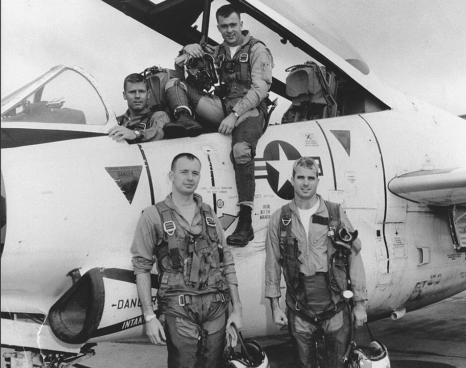 1965: John S. McCain III (lower right) posing with his Navy squadron during flight training.
