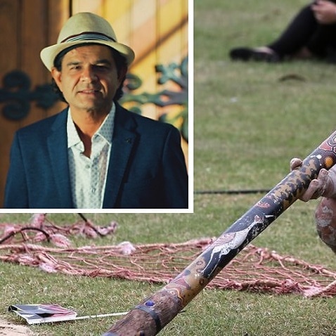 An Aboriginal man plays a didgeridoo during Australia Day in Sydney, Tuesday, Jan. 26, 2016. (Inset - Musician Mahmood Khan)