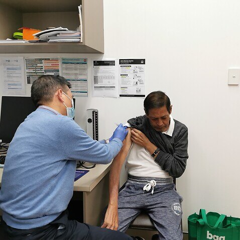 Dr. Zeng is giving vaccinations to those who have made appointments