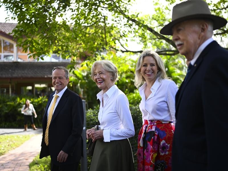 Bill Shorten and former Governor-General Quentin Bryce arrive and his wife Chloe arrive for an Easter service.