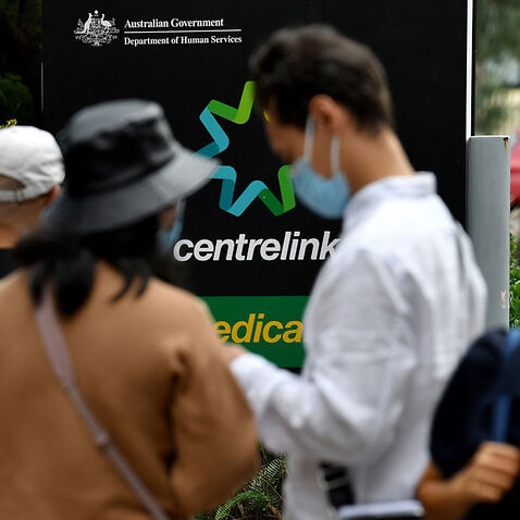 People waiting outside Centrelink office 