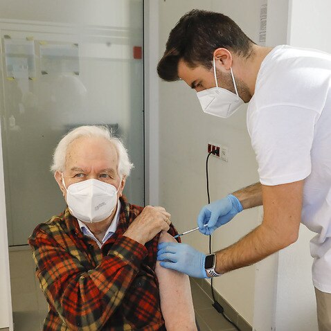A man receives a Pfizer vaccine in Vienna 
