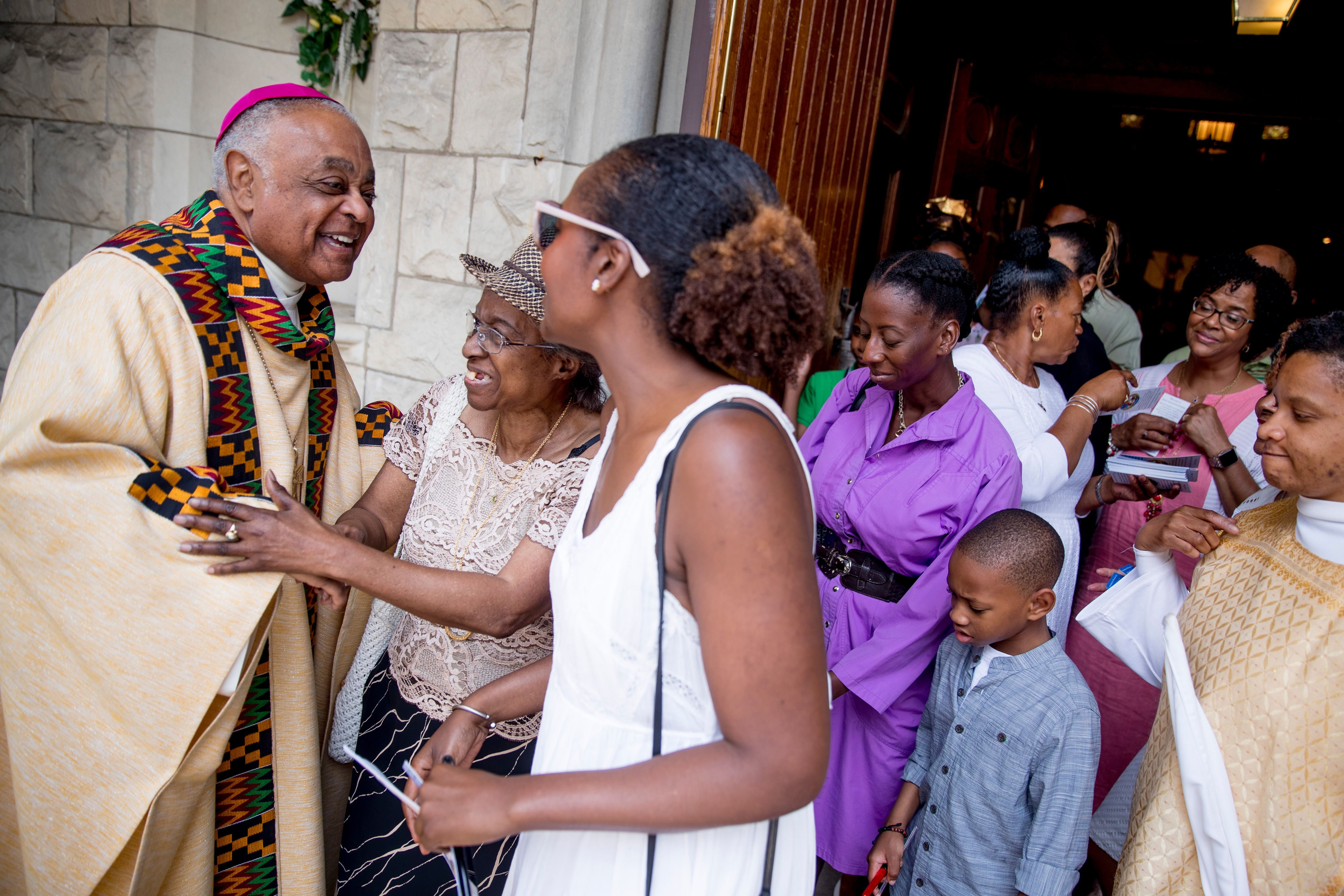 In this June, 2019, file photo, Washington DC Archbishop Wilton Gregory, greets parishioners following Mass at St. Augustine Church in Washington DC.