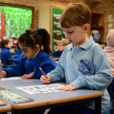 Kindergarten students work on an activity at Annandale Public School in Sydney, Monday, May 25, 2020. 