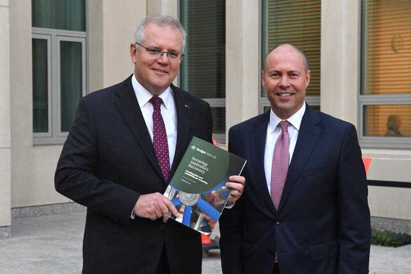 Prime Minister Scott Morrison and Treasurer Josh Frydenberg conducting breakfast television after Treasurer Frydenberg delivered the 2021-22 Budget in the House of Representatives at Parliament House last night in Canberra, Tuesday, May 11, 2021.