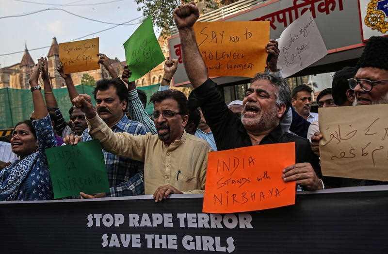 People take part in a protest over Hyderabad rape and murder case, in Mumbai, India
