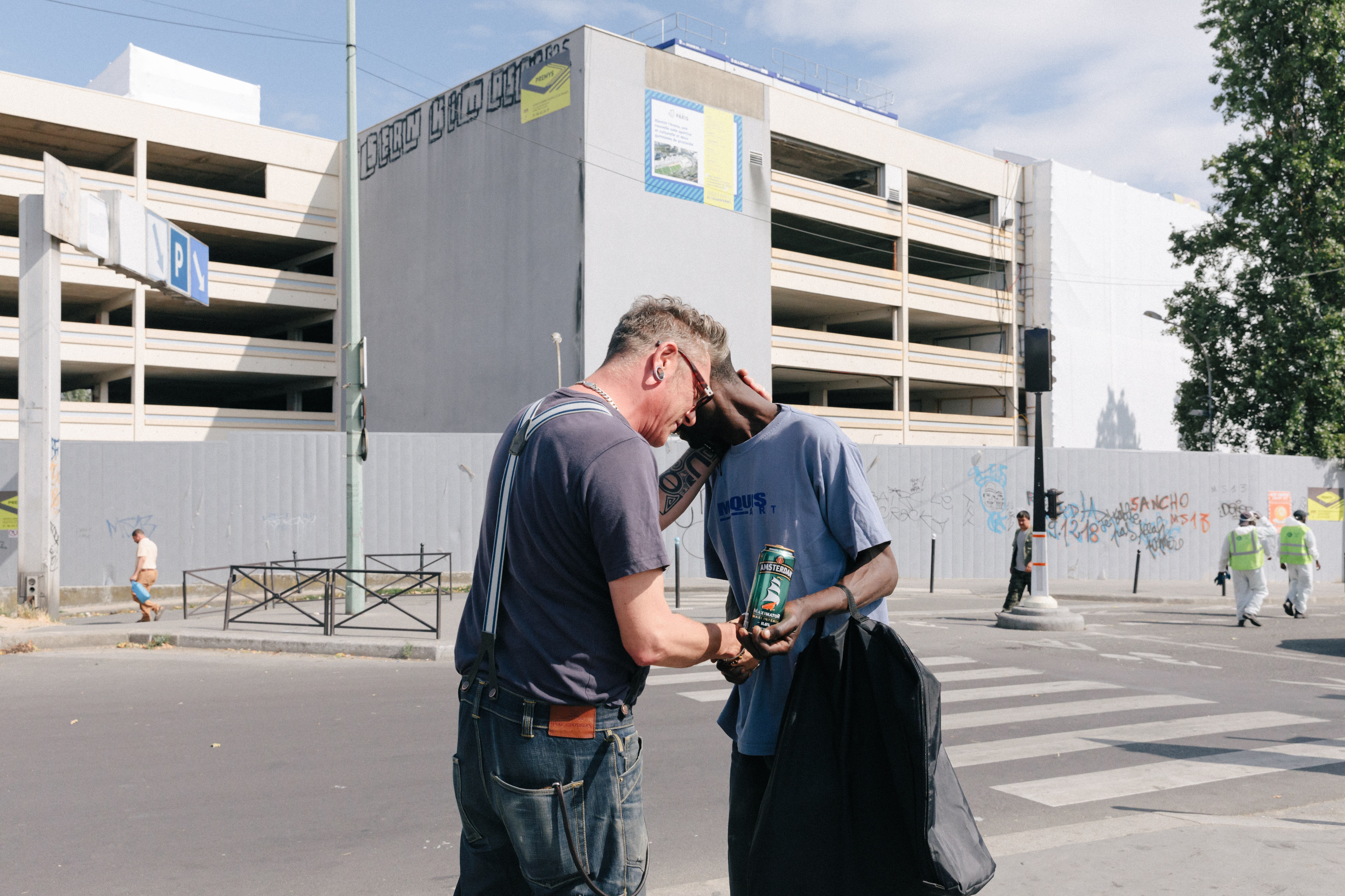 Yves Bouillet, left, a social worker for the Charonne aid organization, in the La Colline neighborhood of Paris, July 30, 2019. Yves Bouillet, left, a social worker for the Charonne aid organization, in the La Colline neighborhood of Paris, July 30, 2019