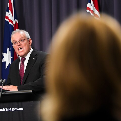 Australian Prime Minister Scott Morrison reacts during a press conference at Parliament House in Canberra, Tuesday, March 23, 2021. (AAP Image/Lukas Coch) NO ARCHIVING