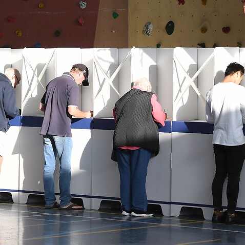 Tasmanians complete ballot forms