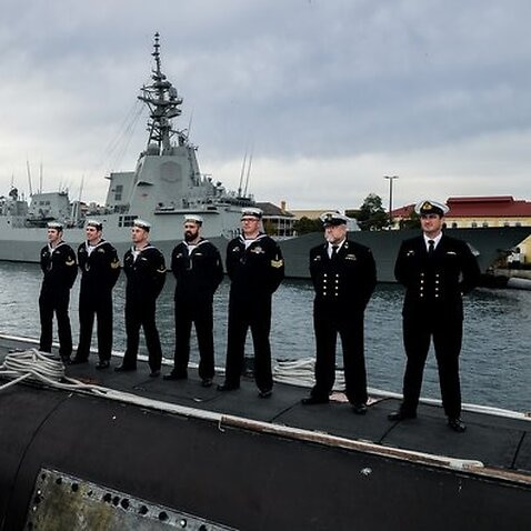 Navy personal stand on the HMAS Waller third of the six Collins class submarines in Sydney  