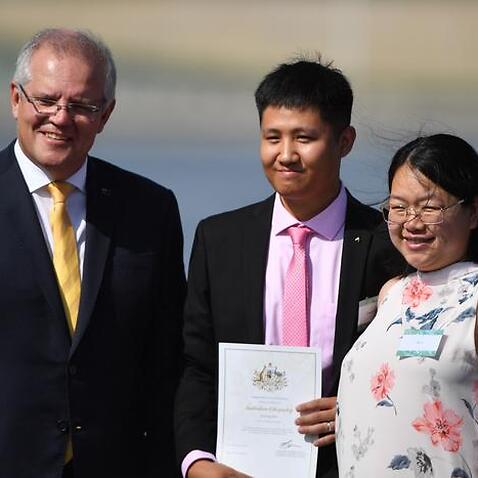 Prime Minister Scott Morrison with new Australian citizens at ceremony in Canberra in January. 
