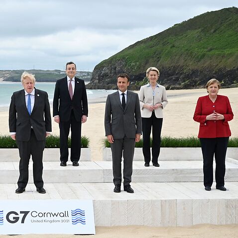 Leaders of Canada, the European Council, the US, Japan, Britain, Italy, France, the European Commission and Germany pose for a photo at the G7 summit.