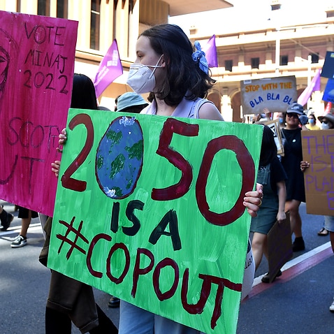 Thousands rally in Sydney calling for greater action to address climate change.
