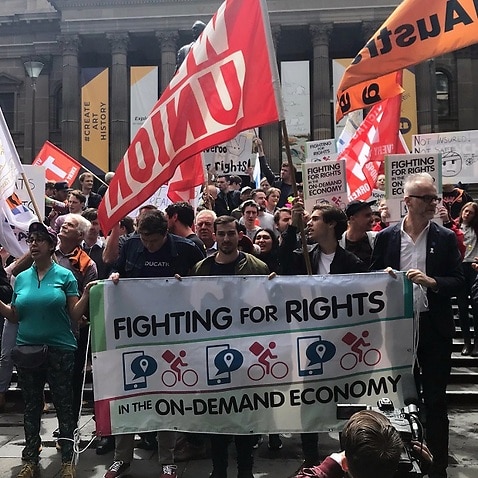 Hundreds protest against poor pay and conditions of food delivery riders in Melbourne.