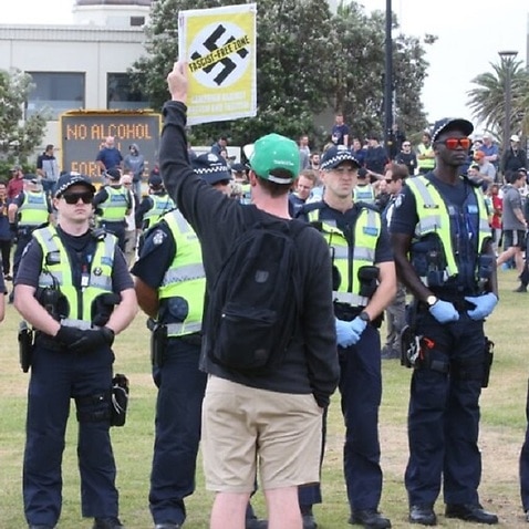 Police watch on as anti-fascist demonstrators gather near a far-right rally on St Kilda foreshore 