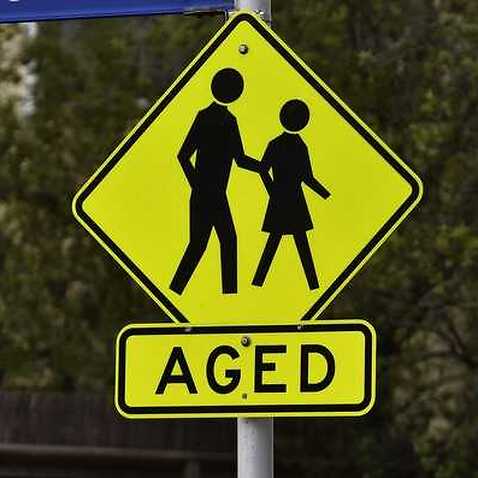 A hazard sign warning drivers of elderly members crossing the street
